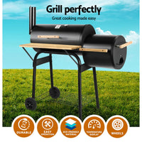 Side profile of the black BBQ smoker highlighting the sealed cooking chamber