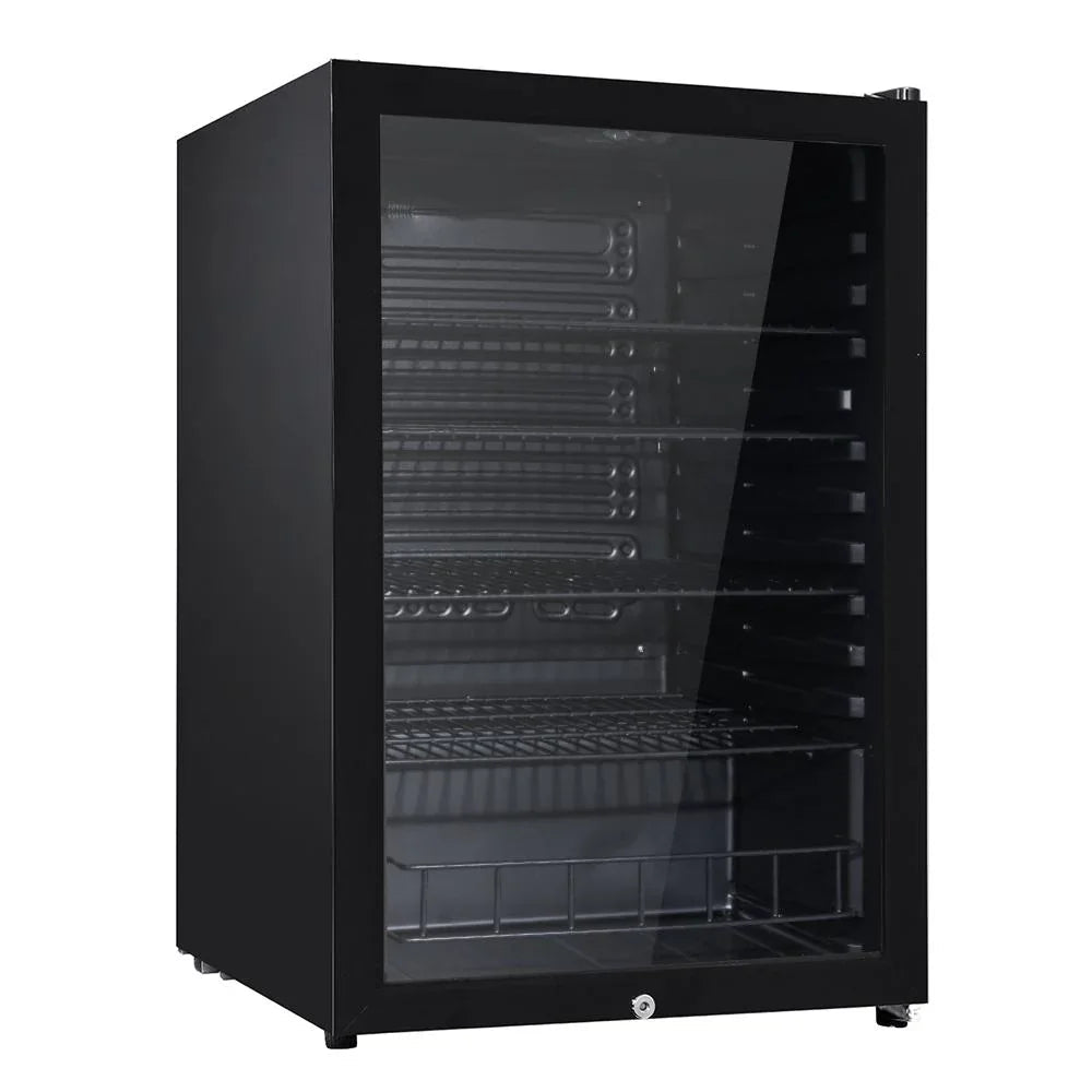 Front view of Devanti 115L bar fridge with glass door, showing illuminated interior and bottled beverages inside.