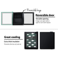 Reversible door feature demonstrated on Devanti mini fridge