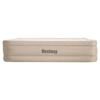 Bestway air bed partially deflated, placed inside a tent with outdoor scenery visible.