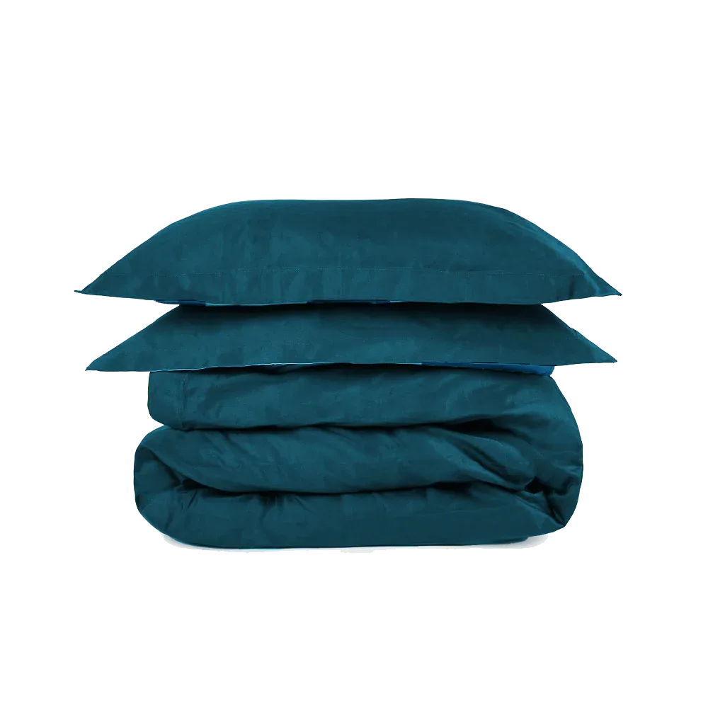 Teal super king duvet set from The House Babylon Collection displayed neatly on a bed, showing smooth 600-thread count cotton