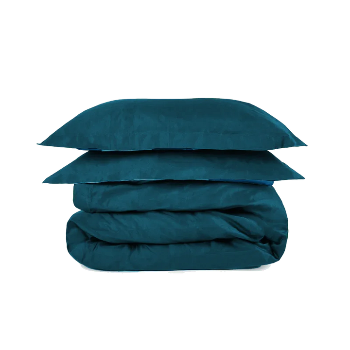 Teal super king duvet set from The House Babylon Collection displayed neatly on a bed, showing smooth 600-thread count cotton