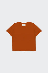 Front view of burnt orange gender neutral short sleeve top for children