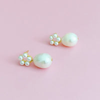 Blooming Freshwater Pearl Drop Earrings displayed on a white background highlighting gold-plated brass and pearl details.