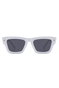 Black square sunglasses angled to show frame curves and lens color.