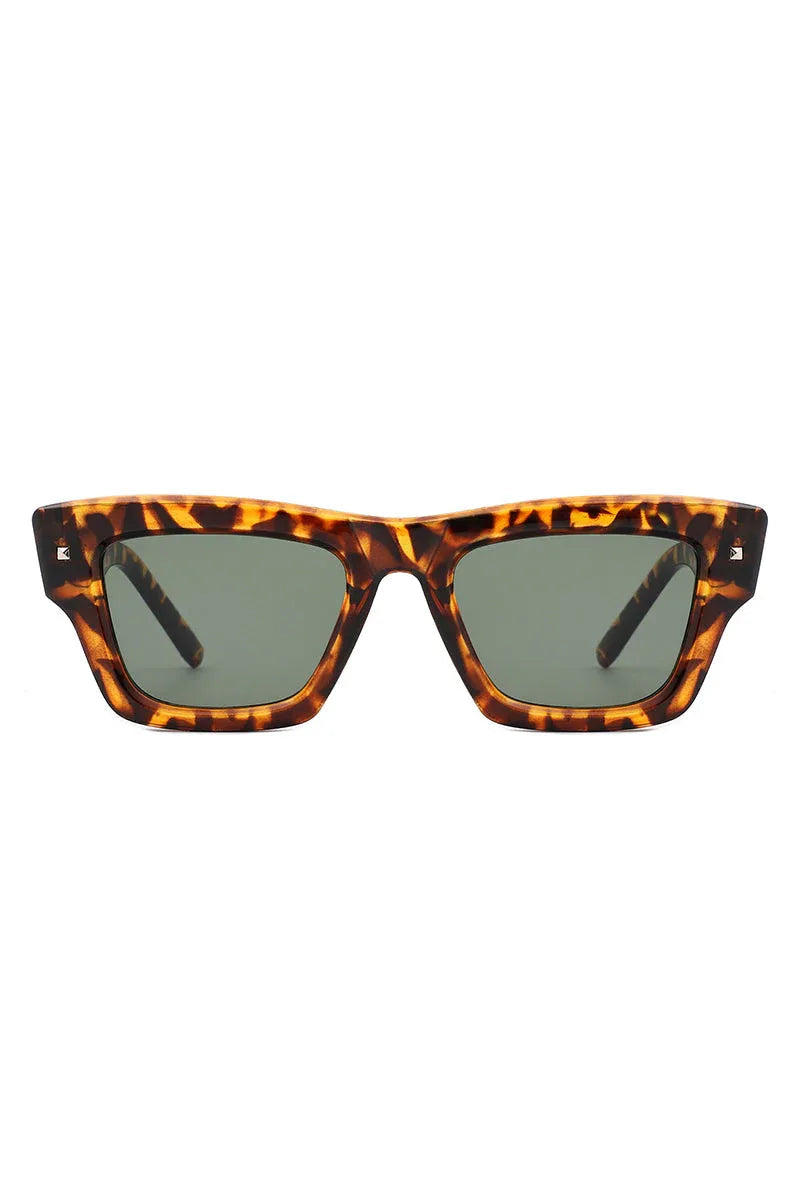 Close-up detail of sunglasses hinge and arm connecting to squared frame.