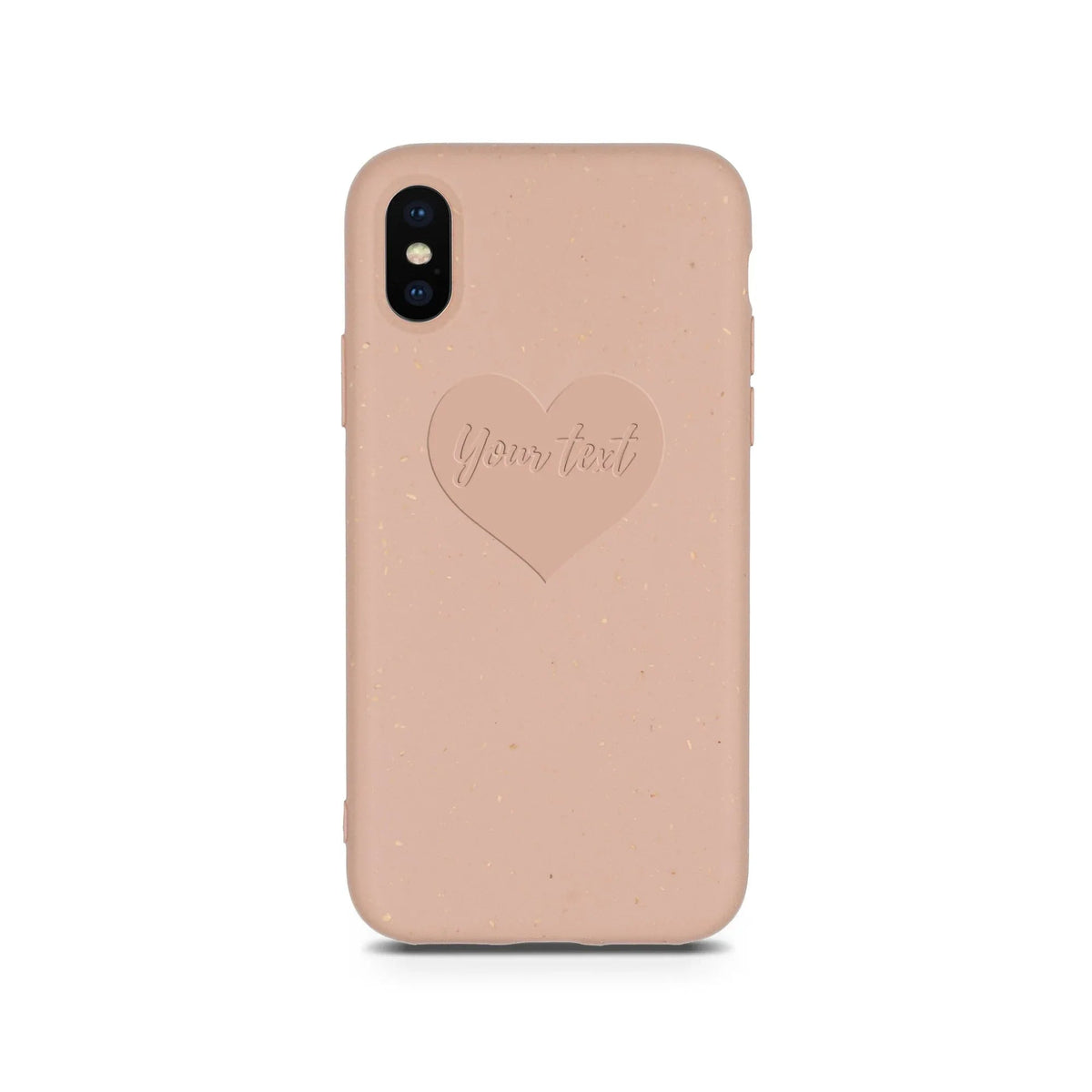 Close-up of compostable pastel pink phone case featuring a small engraved heart design.