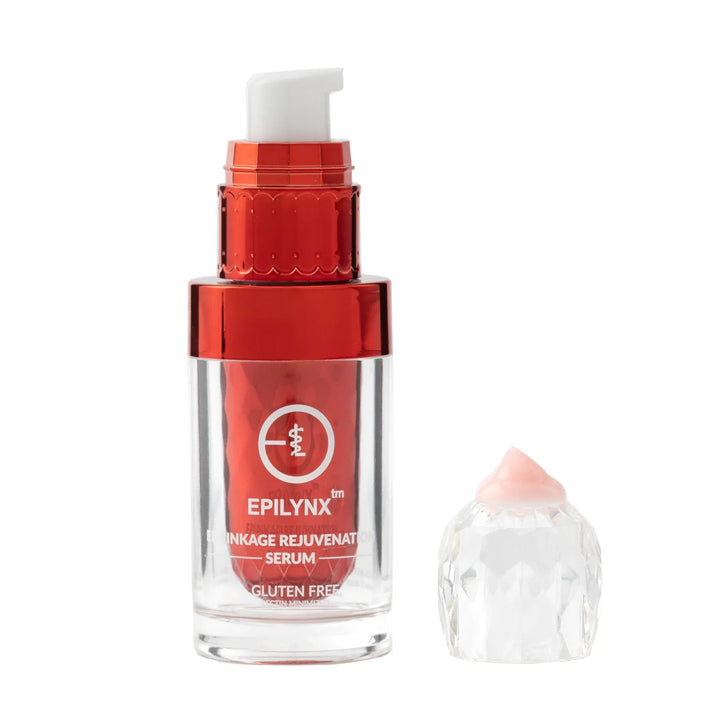 Bottle of Enriching Ageless Rejuvenate Face Serum with liquid dropper on white background.