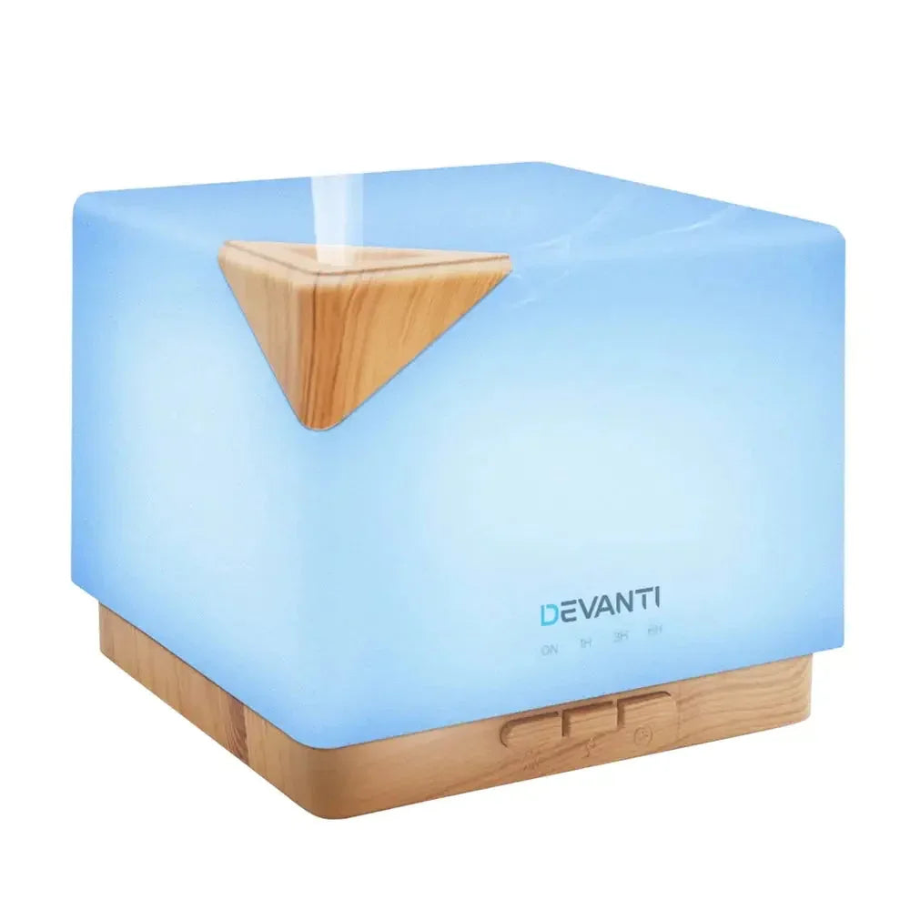 DEVANTi Aroma Diffuser in light wood grain emitting mist on a white surface