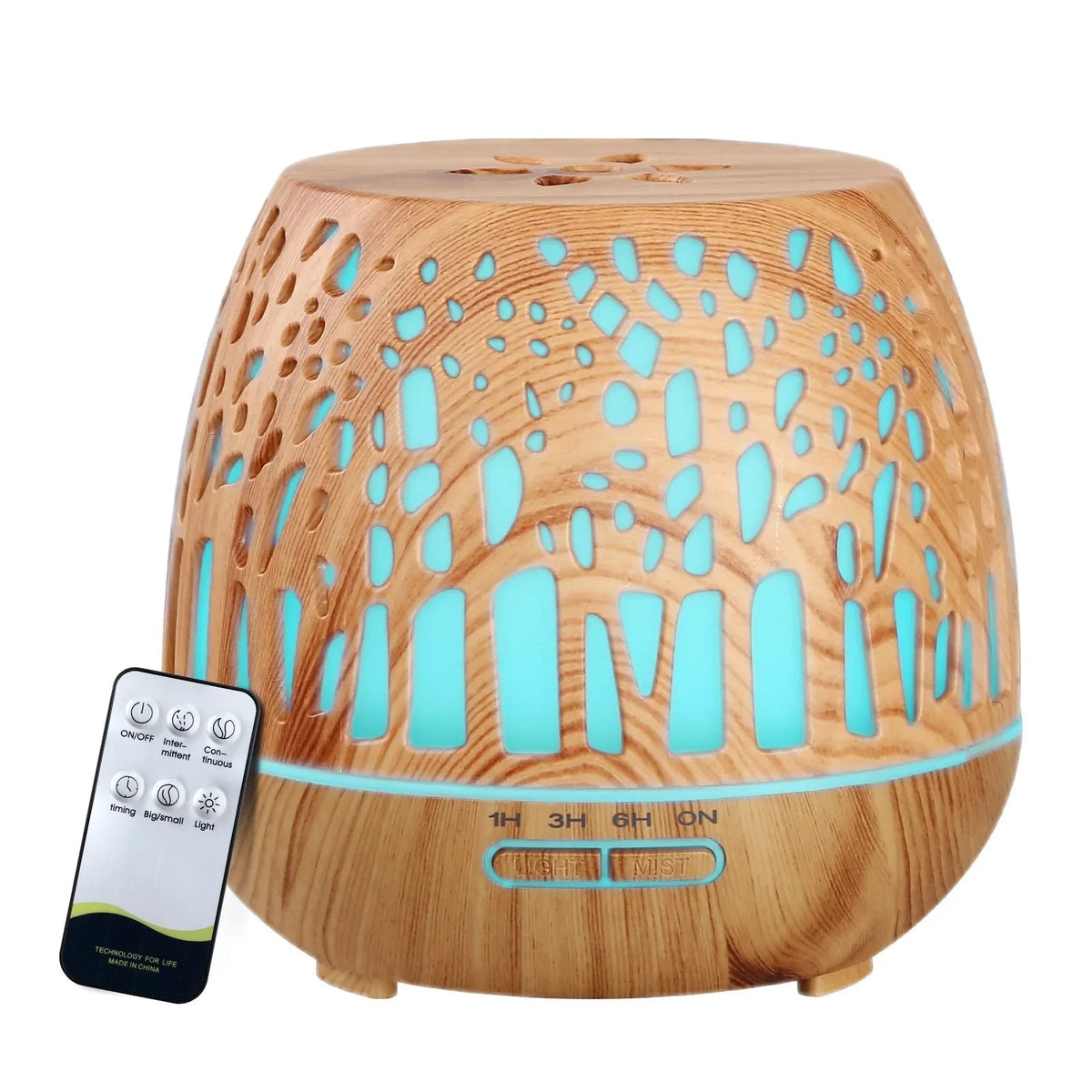 Devanti aroma diffuser with woodgrain finish and enchanted forest pattern on a light surface