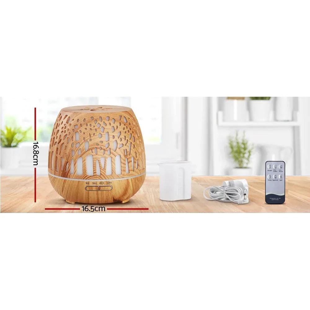 Close-up of the Ultrasonic aroma diffuser showing woodgrain texture and soft glowing light