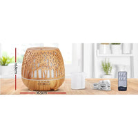 Close-up of the Ultrasonic aroma diffuser showing woodgrain texture and soft glowing light