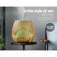 Devanti diffuser producing fine mist with evening lights in a calm setting