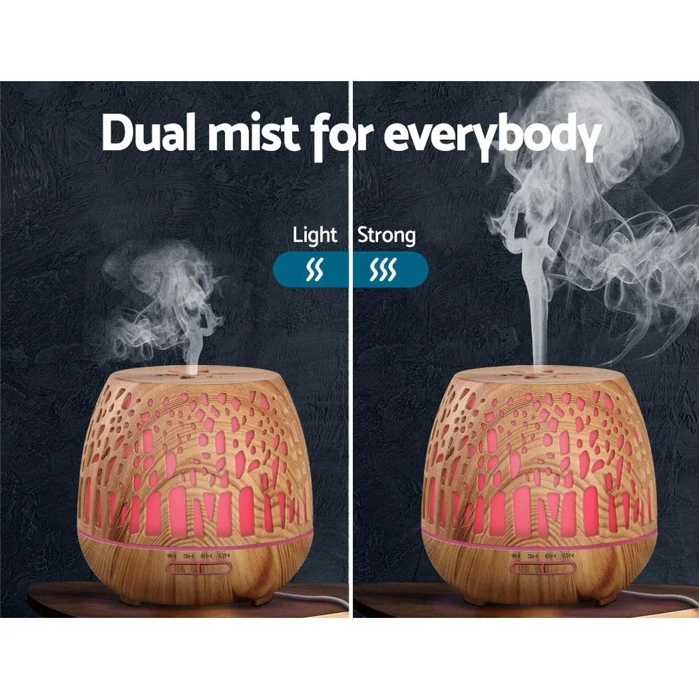 Ultrasonic humidifier with soft green mist illuminated by night light feature