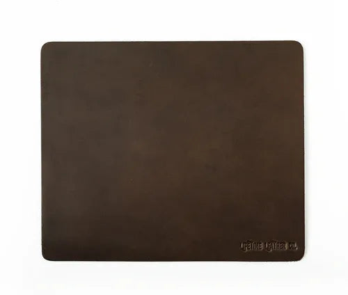 Dark brown full grain leather mouse pad with a smooth finish on a white background.