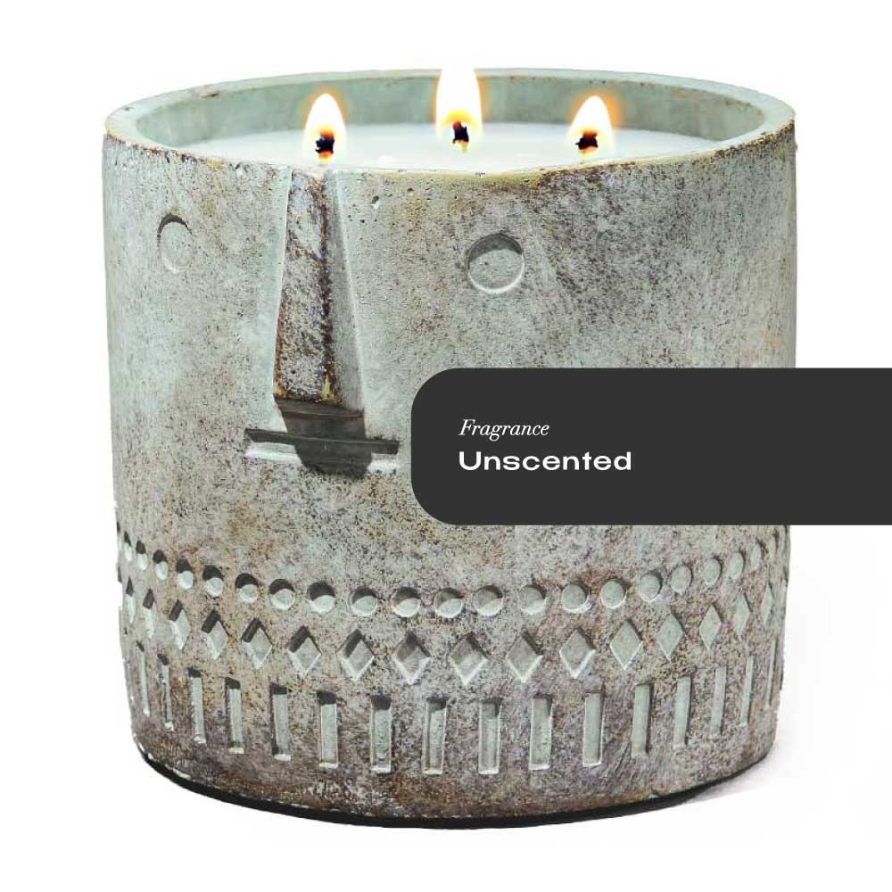 Hand-painted cement vessel candle with sculpted stone face design, unscented, 27oz size on white background.