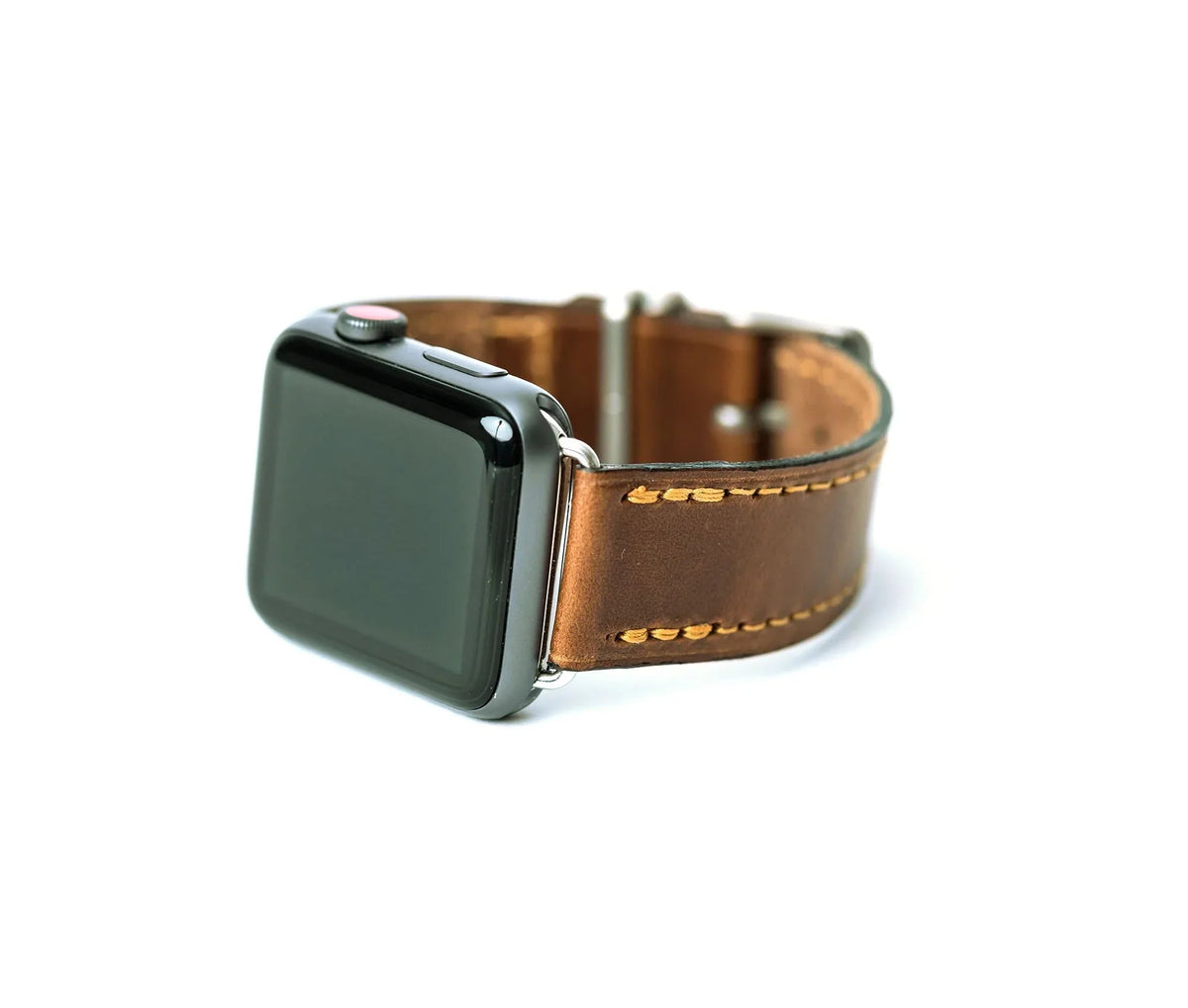 Close-up of brown leather Apple Band Designer watch band showing stitched edges and metal clasp.