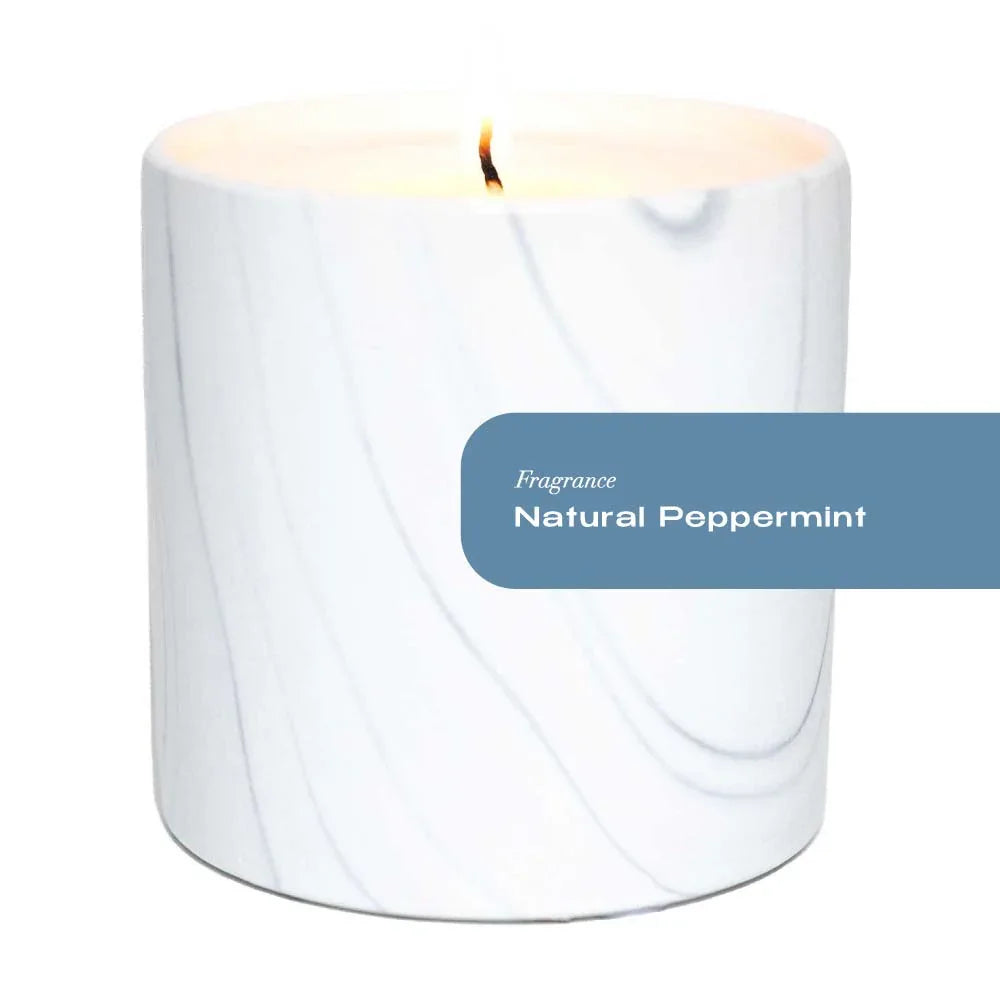Close-up of white marble ceramic vessel with gray and black swirls for peppermint scented candle.