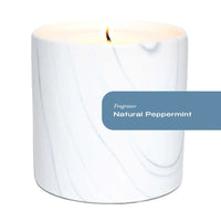 Close-up of white marble ceramic vessel with gray and black swirls for peppermint scented candle.