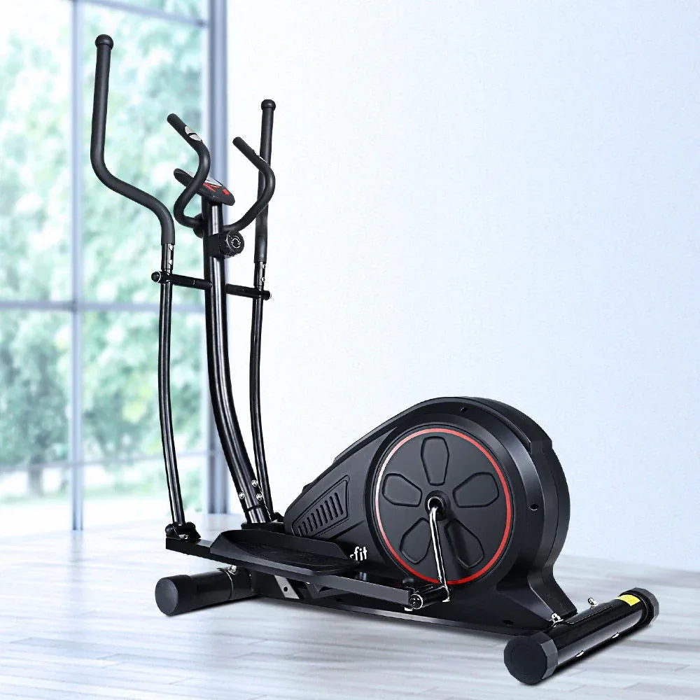 Elliptical cross trainer positioned in a home gym setting with natural light