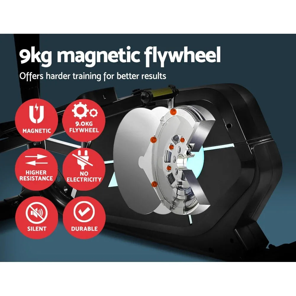 User gripping the handles of the Everfit elliptical cross trainer during exercise.