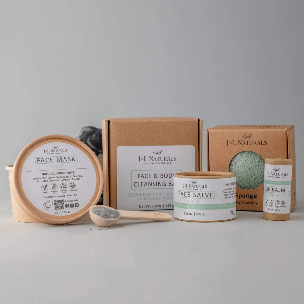 Calm set for sensitive skin showing cleansing bar and konjac sponge with natural elements.