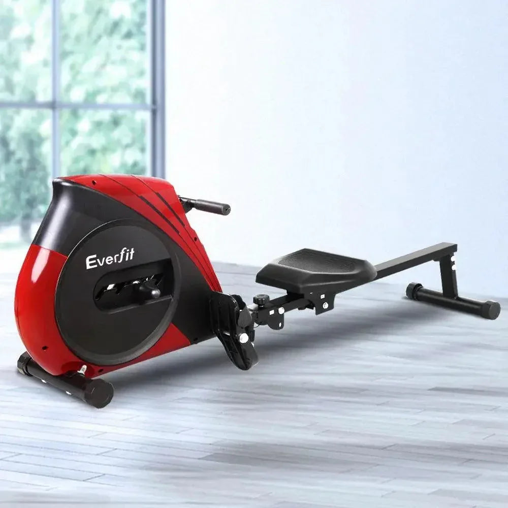 User seated on the Everfit rowing machine demonstrating a rowing exercise motion.