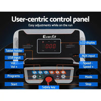 Treadmill displaying digital speed and workout data on LCD screen in bright lighting
