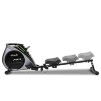 Rowing machine displayed in a home gym setting with visible large LCD console