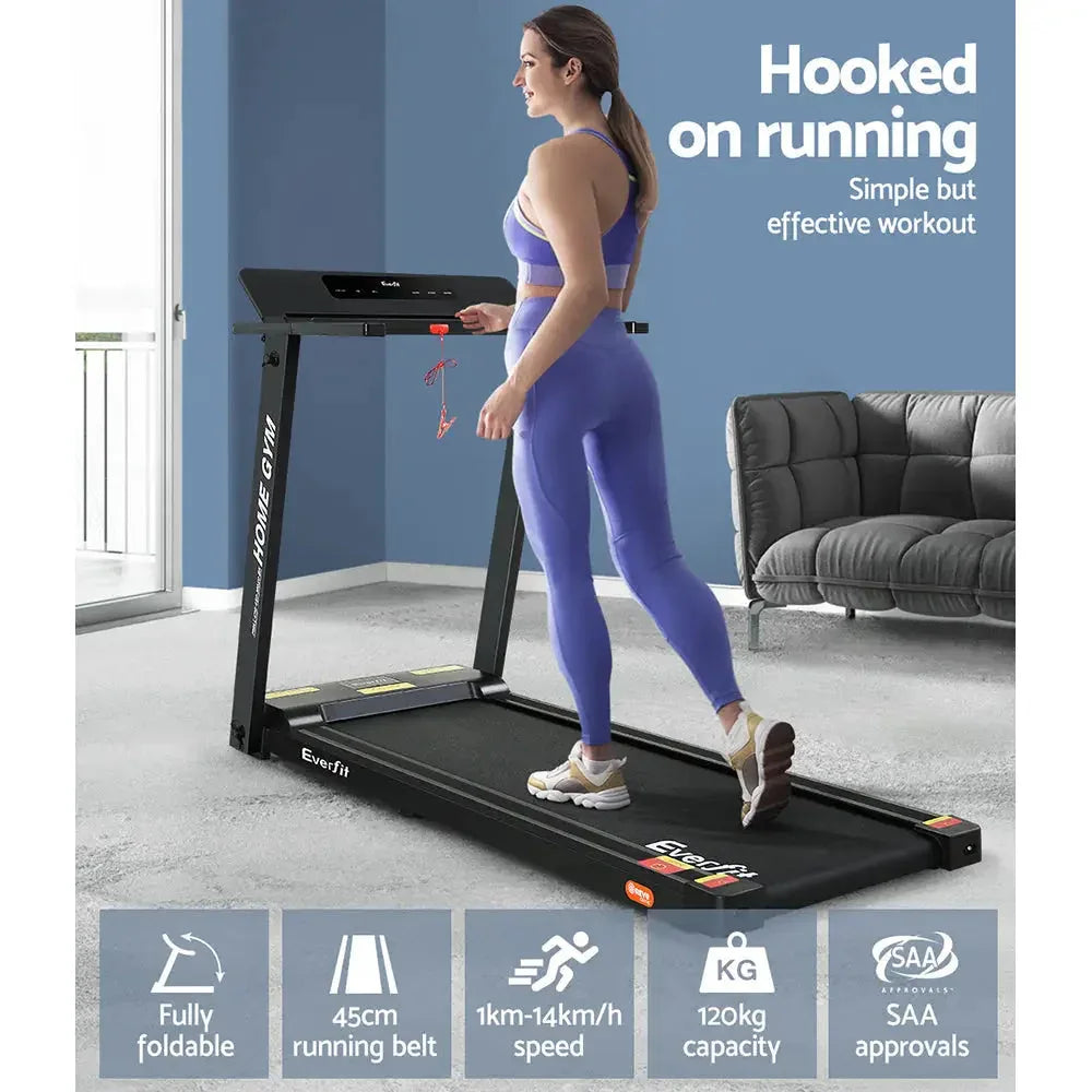 Everfit treadmill with safety side rails and foot platform visible.
