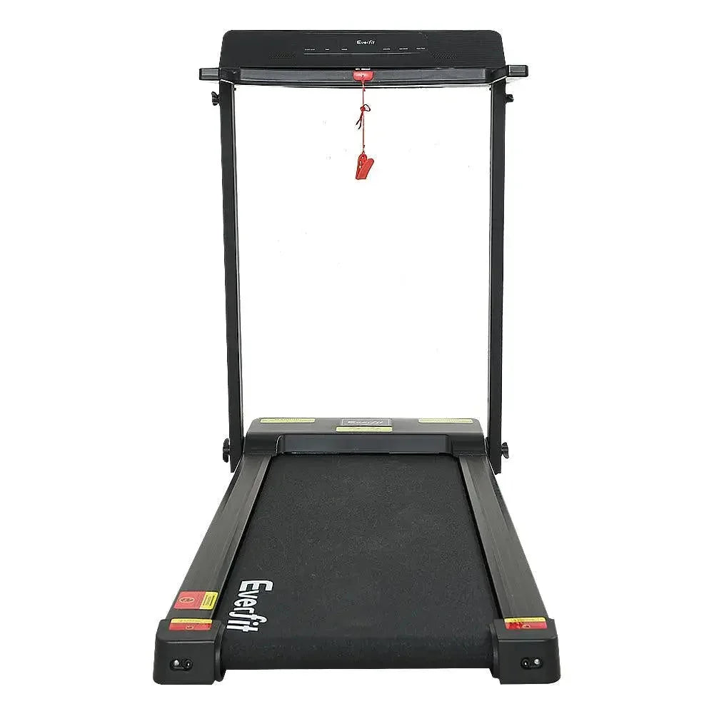 Side view of the treadmill unfolded with running belt and sturdy steel frame.