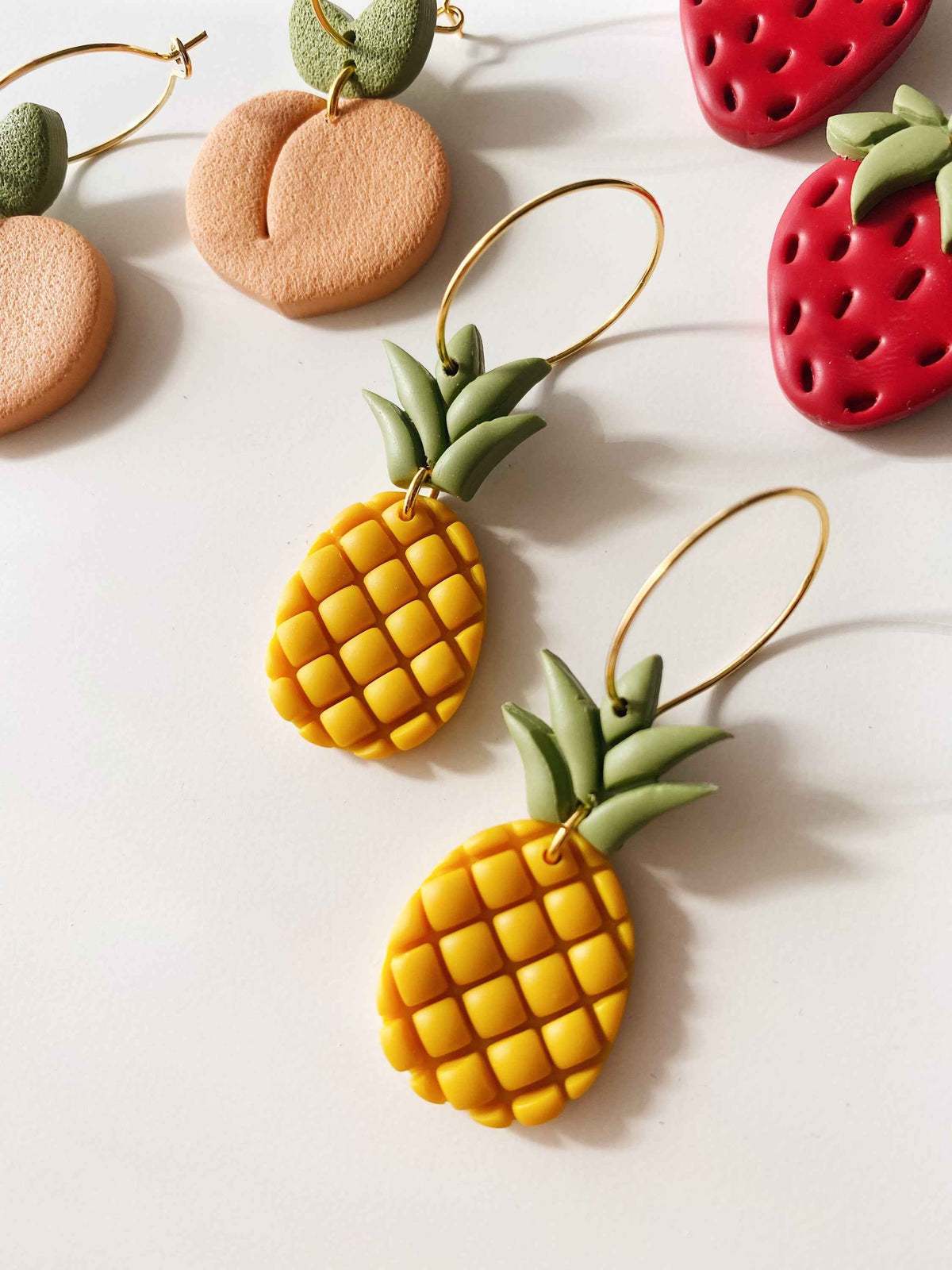 Pineapple Hoops - handcrafted polymer clay pineapple-shaped hoop earrings with hypoallergenic posts, Snagva