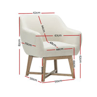 Side view of beige fabric armchair showcasing its curved back and thick cushioned seat