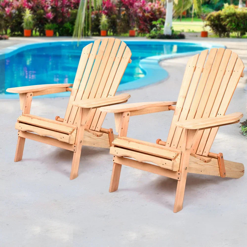 Wooden patio chair folded and resting on light wooden deck outdoors.