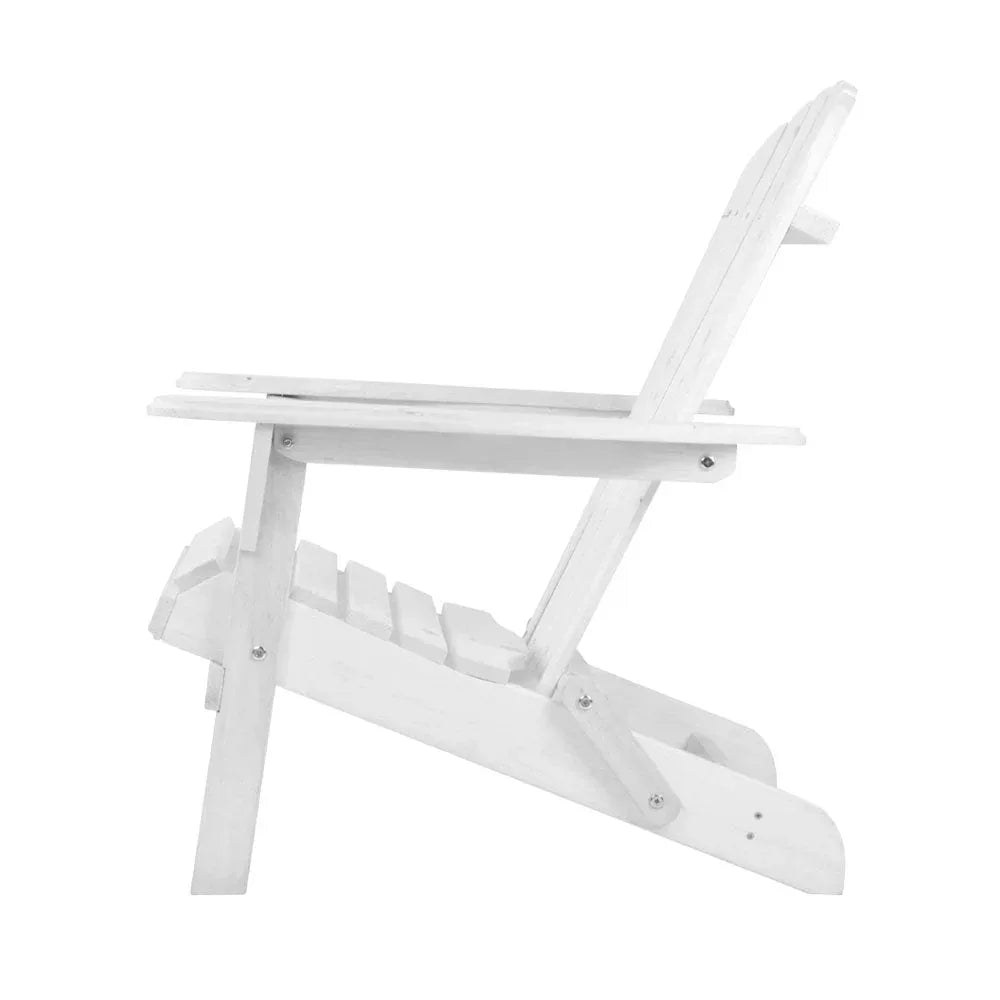 White Adirondack chair on patio near outdoor table under natural sunlight.