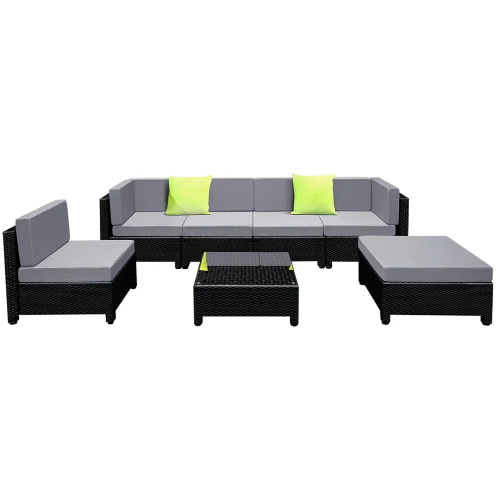 Wicker sectional sofa with thick seat cushions under natural outdoor lighting.