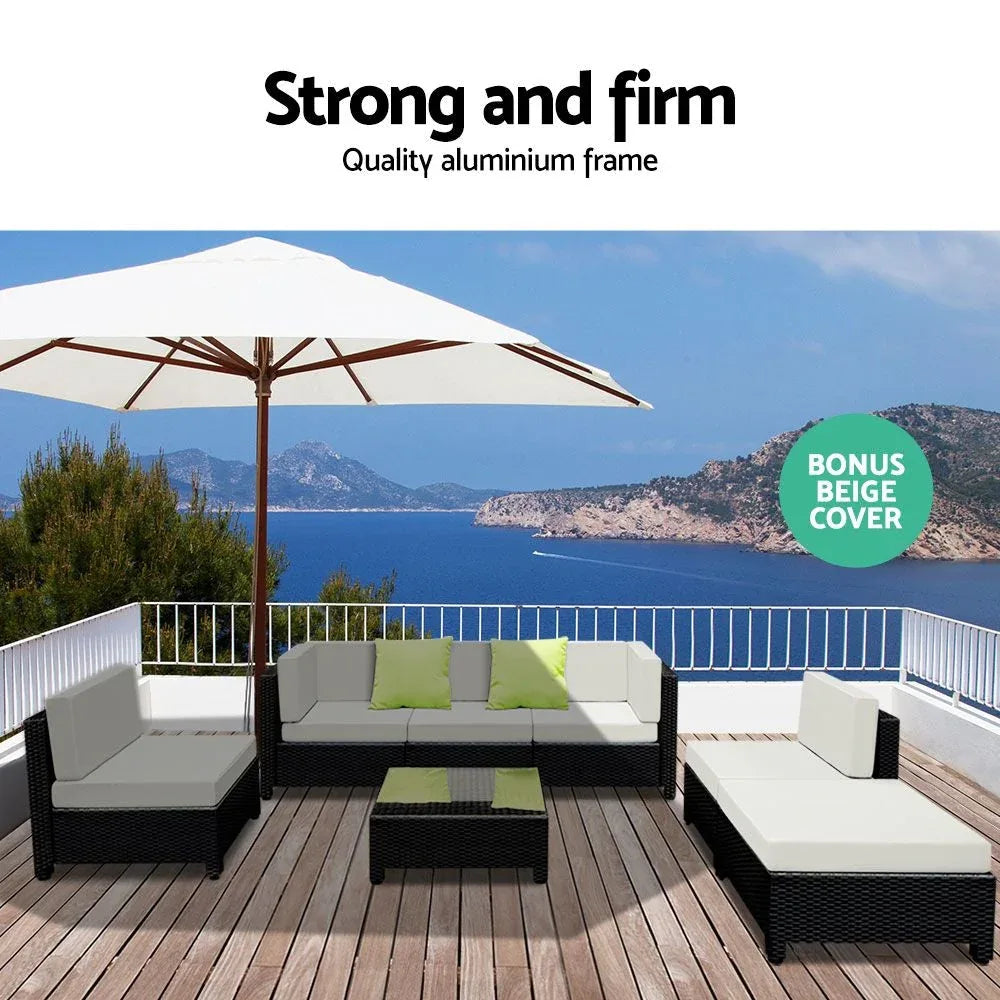 Wicker outdoor sectional seating arranged for casual backyard gathering.