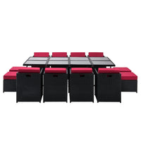 Top view of the rectangular wicker dining table showing glass tabletop and cushioned chairs around.