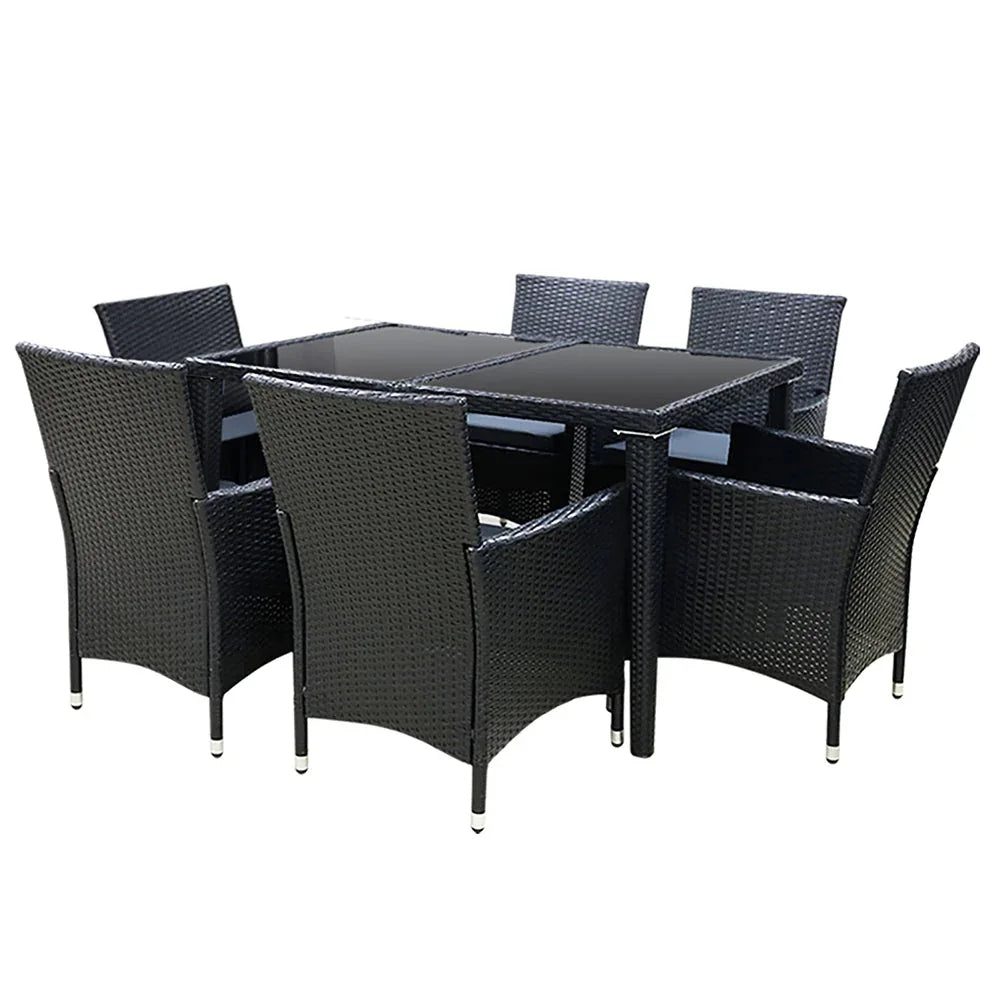 Side view of cushioned black rattan chair highlighting foam seat and sleek aluminum frame