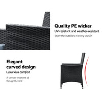 Close detail of woven black PE rattan chair armrest and cushion texture