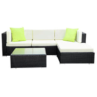Gardeon outdoor sofa set with glass-top table and cushioned seats under sunlight