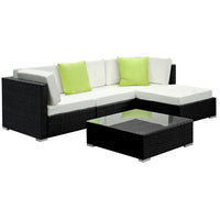 Side view of black aluminum framed outdoor wicker sofa with removable cushions