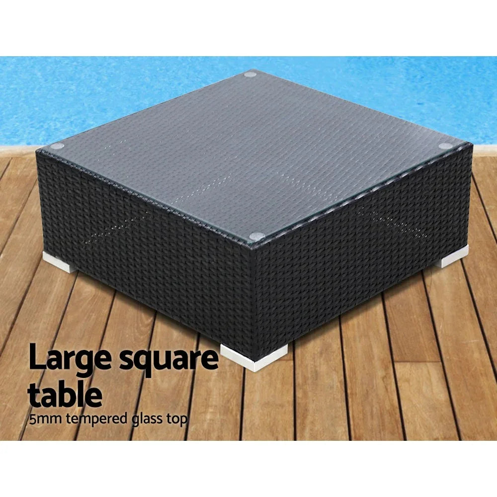 Close-up of cushioned corner table accessory on black wicker outdoor furniture set