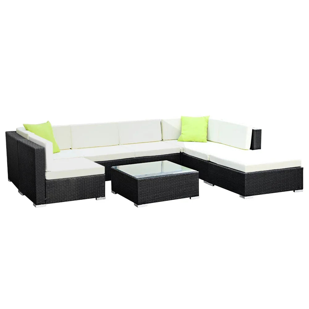 Gardeon 8PC sofa set arranged outdoors with glass-topped coffee table and additional corner table.