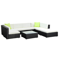 Gardeon 8PC sofa set arranged outdoors with glass-topped coffee table and additional corner table.
