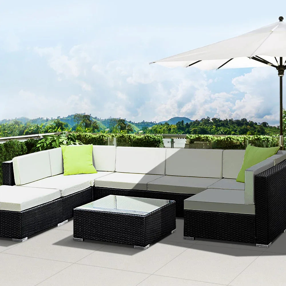 Gardeon sofa set with cushions on patio, showing spacious seating and water-resistant materials.