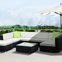 Gardeon sofa set with cushions on patio, showing spacious seating and water-resistant materials.