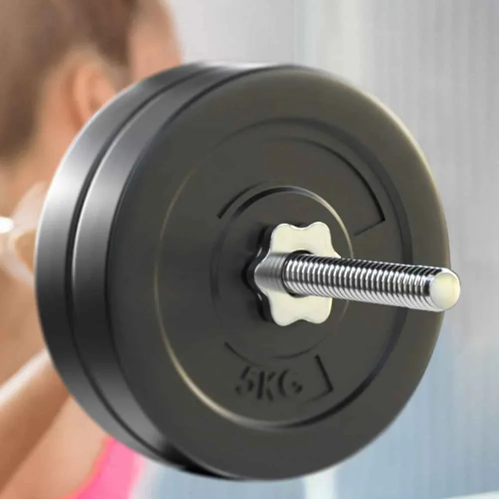 Side view of barbell with rubber-coated weight plates in a gym setting