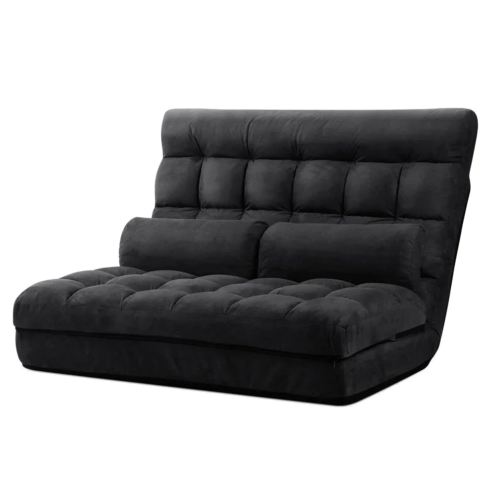 Charcoal suede 2-seater lounge sofa bed in flat, floor-level position with plush cushions.