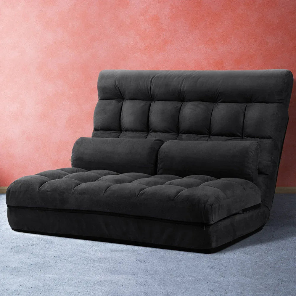 Charcoal 2-seater lounge sofa bed shows compact folded configuration for storage.